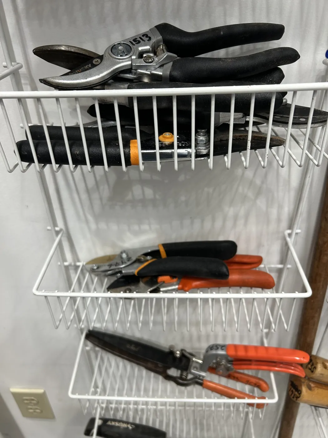 Pruners and loppers organized in wire baskets